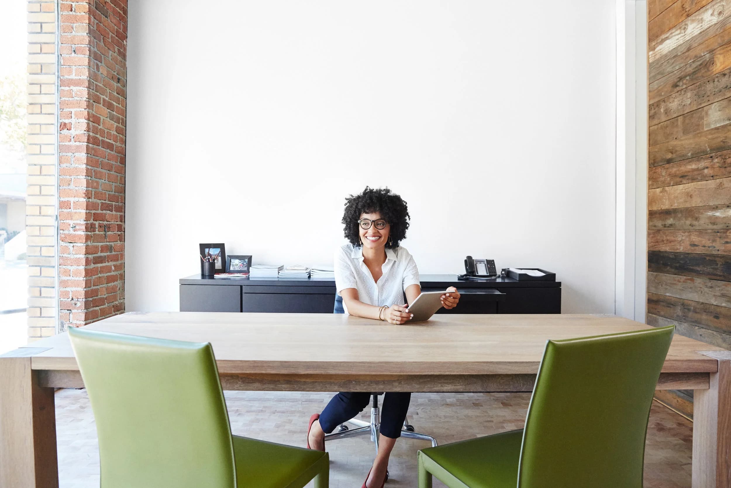 Professional working with a tablet at an office desk